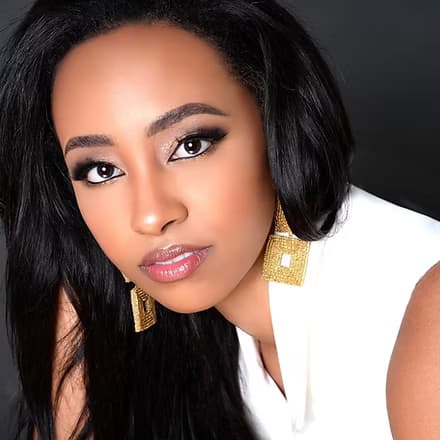 Mariluz Cook, Miss Miami 2020 and 2021, in formal attire.