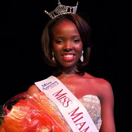 Lerato Seano, Miss Miami 2014, holding a bouquet after win