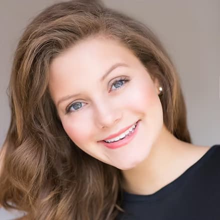 Team Member, Miss Miami Beach 2020, smiling in evening gown.